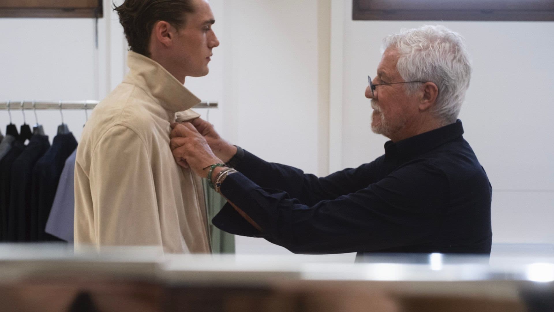 A tailored menswear look styled against the Armani logo