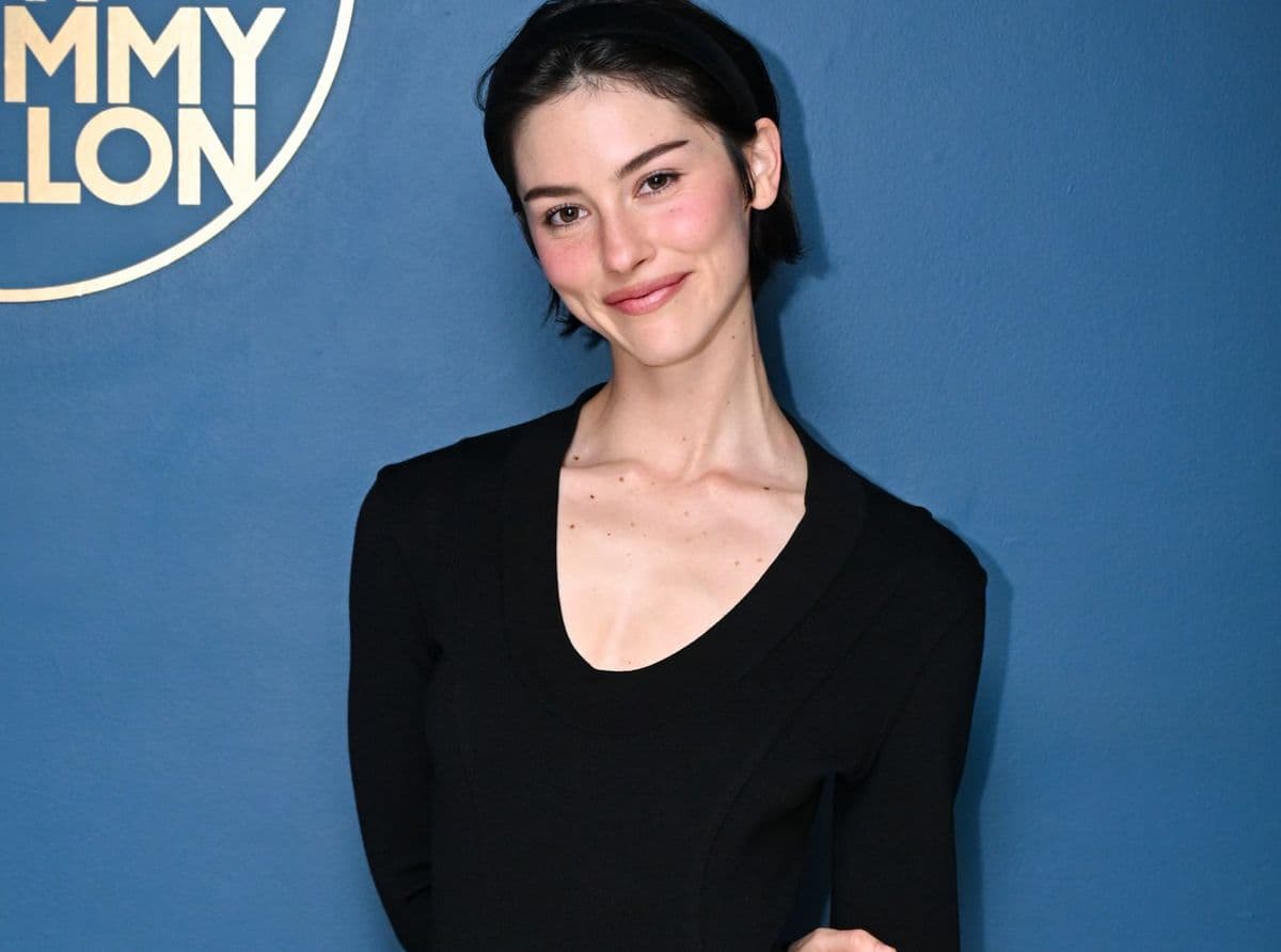 Close-up portrait of a woman with short dark hair and clear, healthy-looking skin